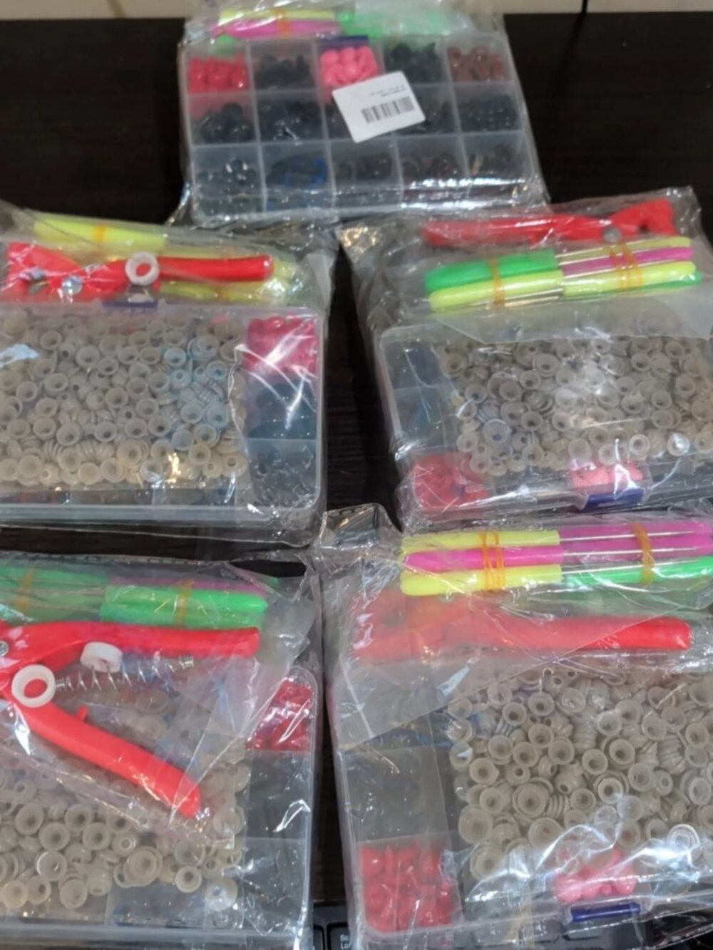 Assortment Of Plastic Snaps And Hand Tools For Sewing And Crafting DIY Projects